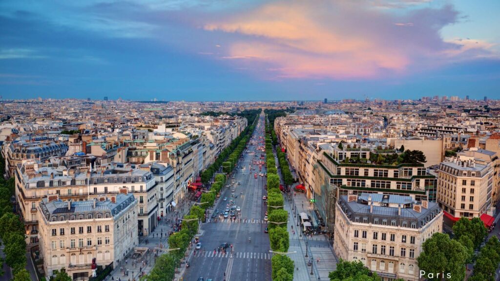 Iconic Champs-Élysées in Paris lined with luxury shops, cafes, and the Arc de Triomphe