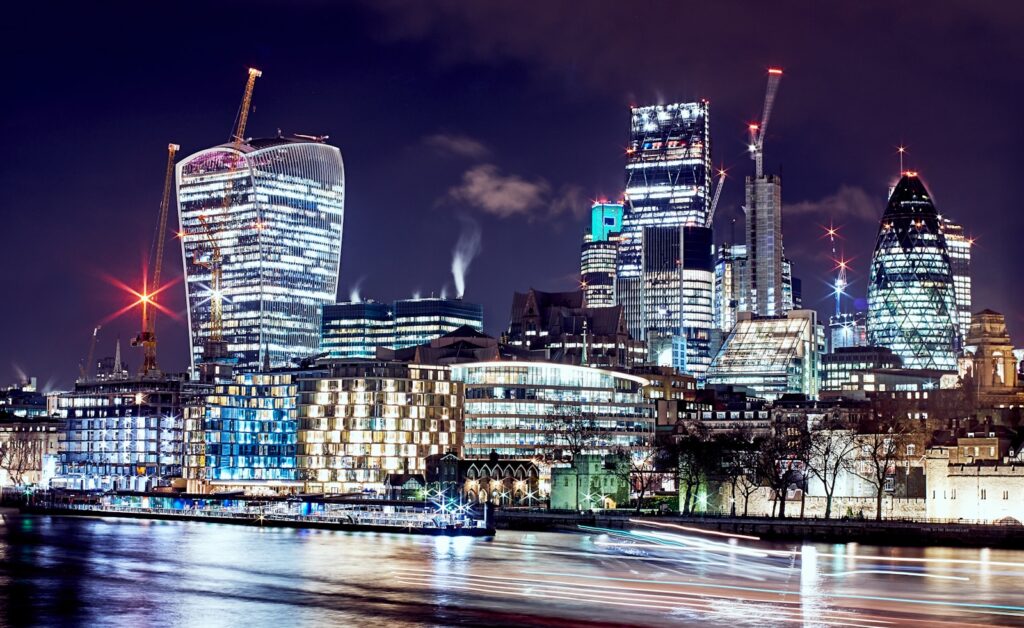 London's financial district with the Gherkin and the Shard, capturing the buzz and hustle of this lively business hub- many Americans move to London for Finance jobs